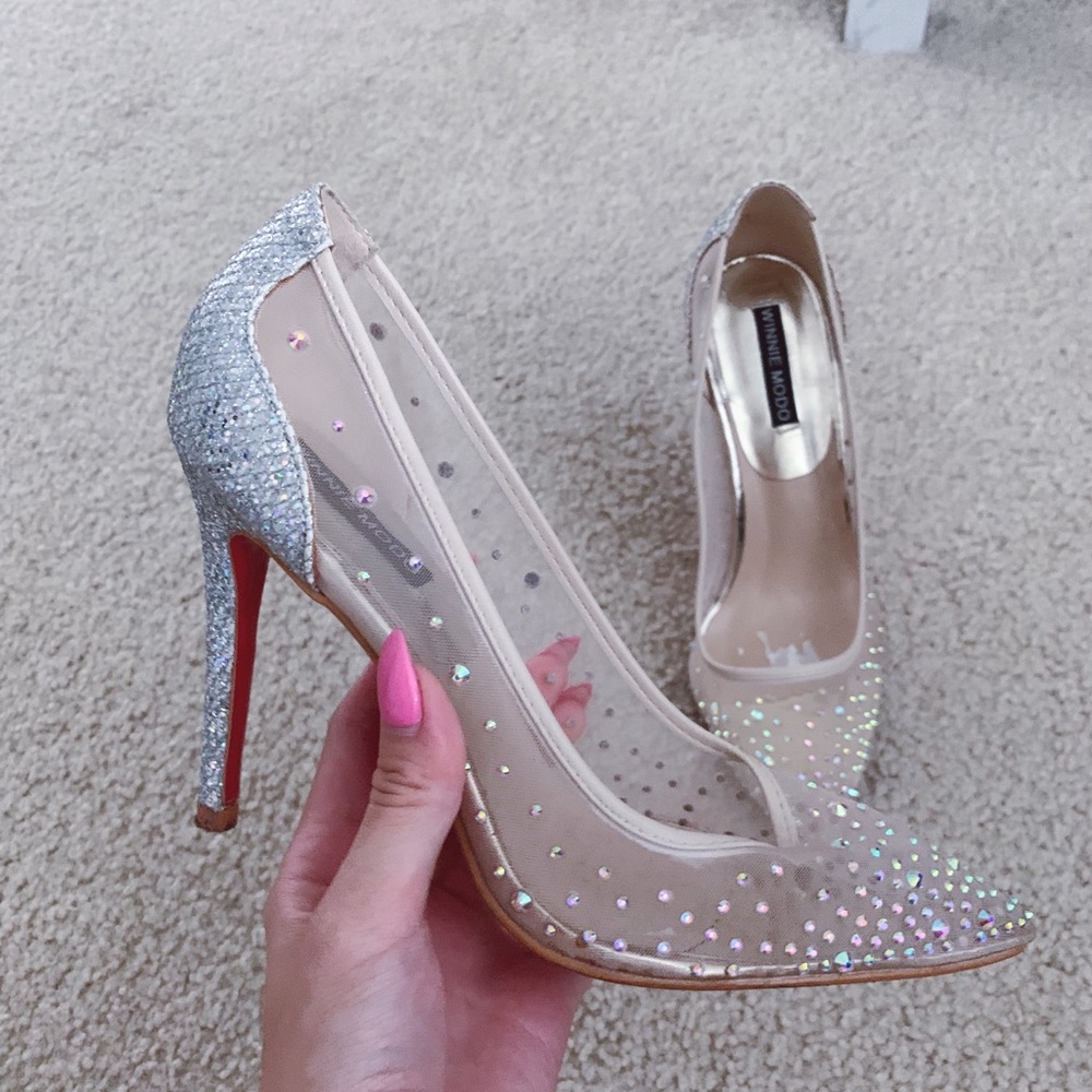 Red bottom sparkly pointed pumps with crystals